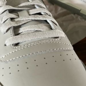 Reebok ,Leather, New in box And never worn. Color is a light gray